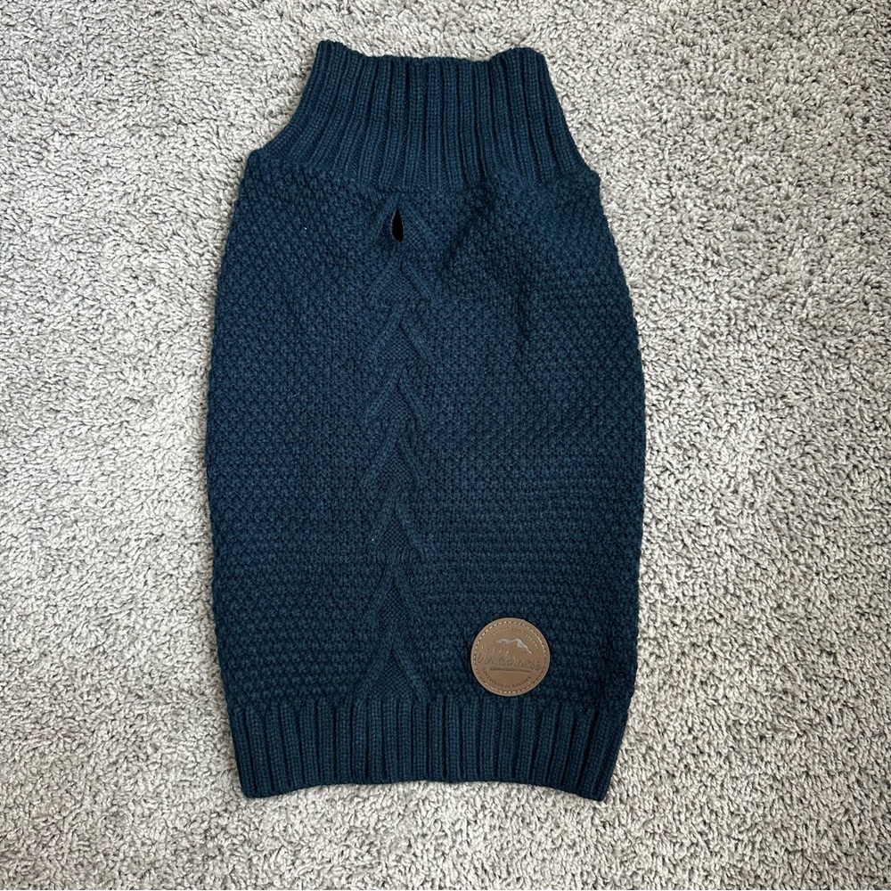 Dog sweater size XL. New. Color blue with a brown logo.